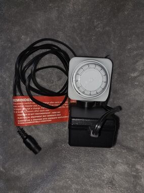 ^ Razor Scooter Power Charger with White Timer Dial